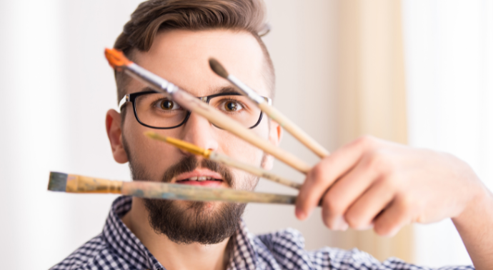 Twelve2 Marketing artist holding brushes